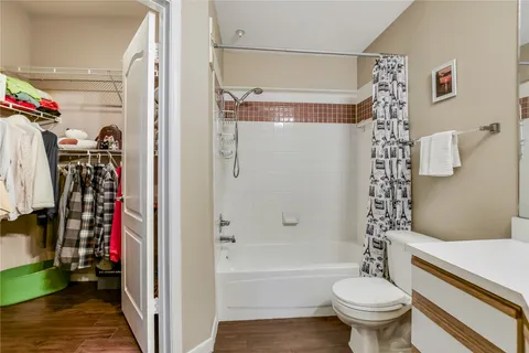 a bathroom with a sink toilet a mirror and shower