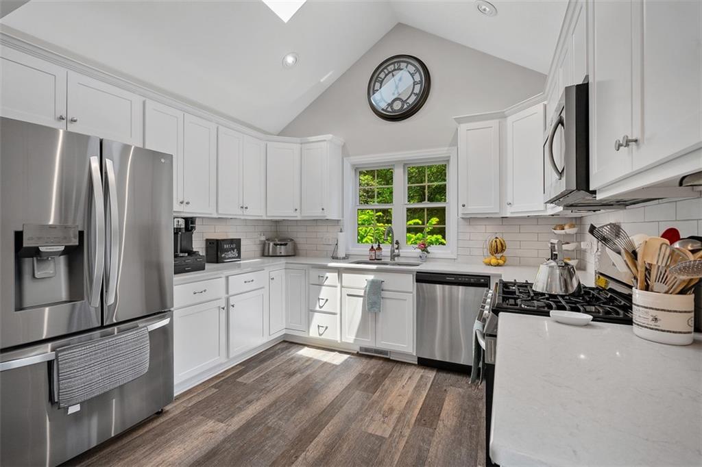505 Center Grange Road Monaca, PA 15061 - Photo 11 of 43 a kitchen with a refrigerator and a stove top oven