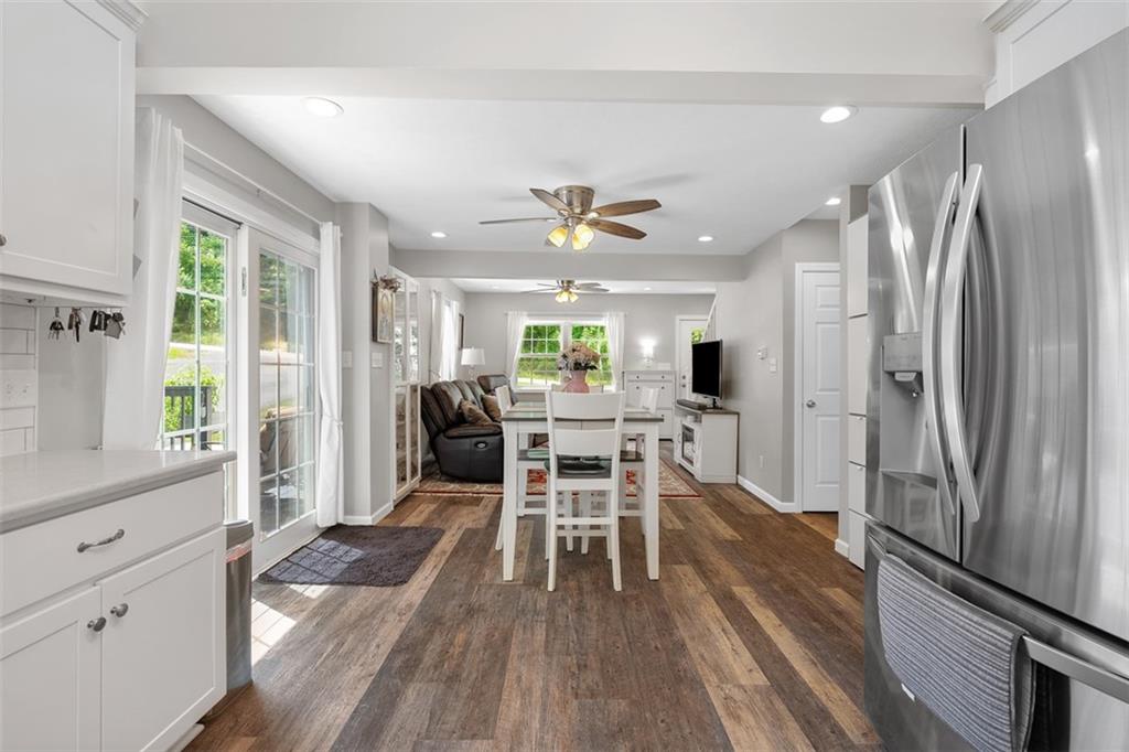 505 Center Grange Road Monaca, PA 15061 - Photo 14 of 43 a dining room with wooden floor and stainless steel appliances