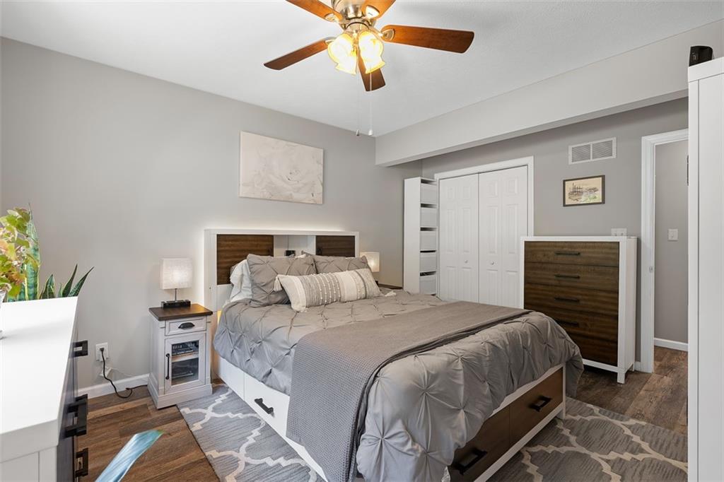 505 Center Grange Road Monaca, PA 15061 - Photo 16 of 43 a bedroom with a bed and a chandelier