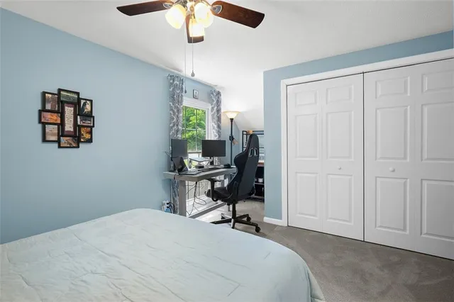 a room that has a bed and a chair in it