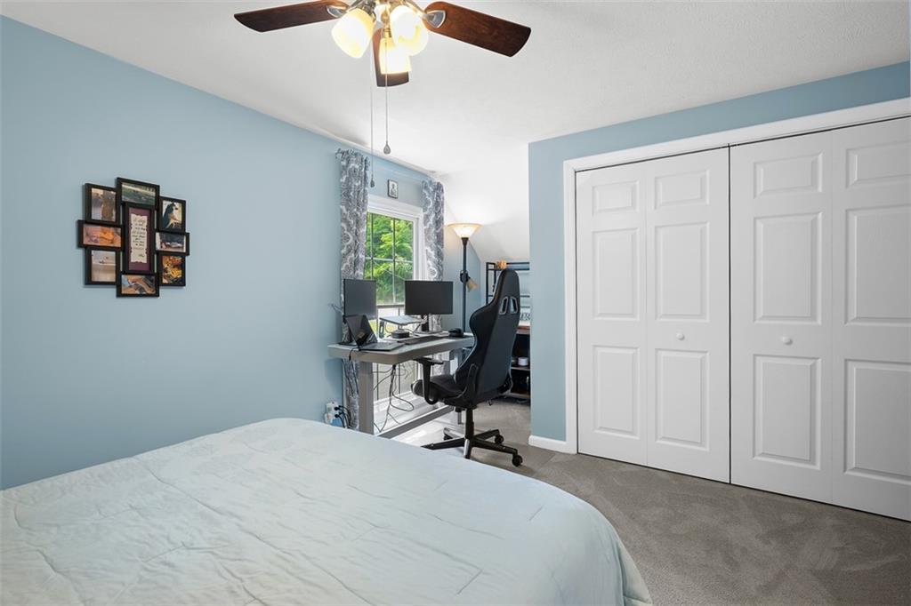 505 Center Grange Road Monaca, PA 15061 - Photo 24 of 43 a room that has a bed and a chair in it