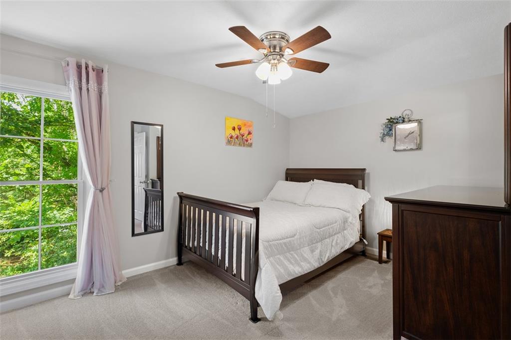 505 Center Grange Road Monaca, PA 15061 - Photo 25 of 43 a bed sitting in a bedroom next to a window