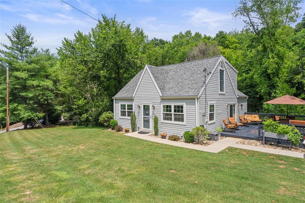 505 Center Grange Road Monaca, PA 15061 - Photo 3 of 43 a view of a house with a backyard and a patio