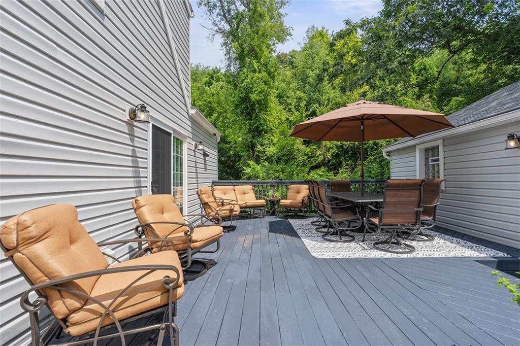 505 Center Grange Road Monaca, PA 15061 - Photo 35 of 43 a view of backyard with seating space and wooden floor