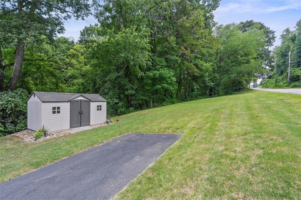 505 Center Grange Road Monaca, PA 15061 - Photo 39 of 43 a front view of a house with a yard and trees