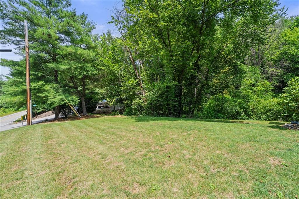 505 Center Grange Road Monaca, PA 15061 - Photo 40 of 43 a view of a field with trees in front of it