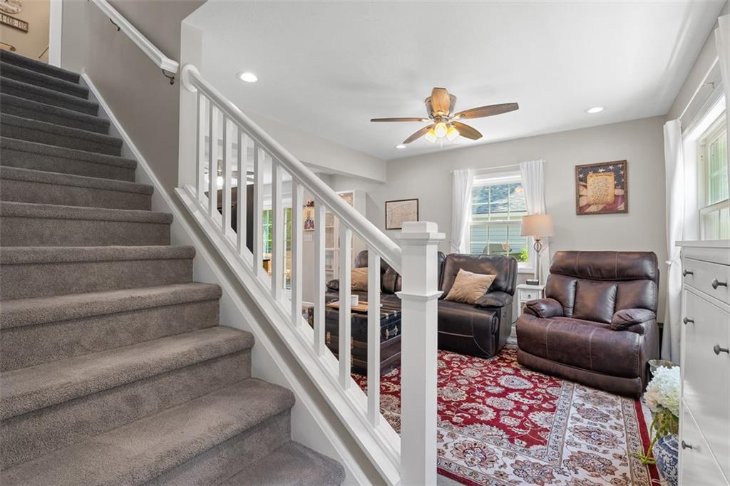 505 Center Grange Road Monaca, PA 15061 - Photo 5 of 43 a living room with furniture or stairs and a chandelier
