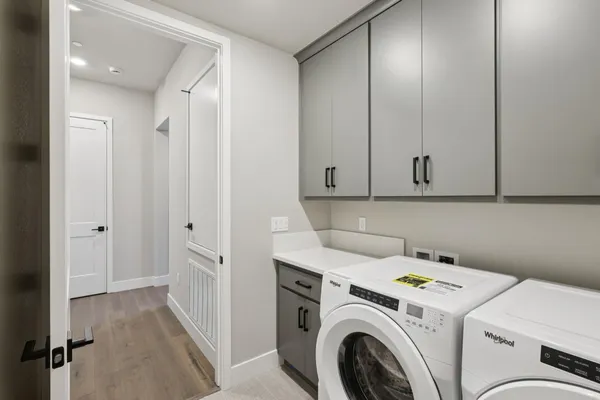 a view of storage and utility room with washer and dryer