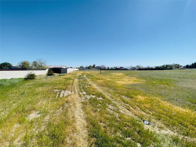 a view of a living room with a wooden floor