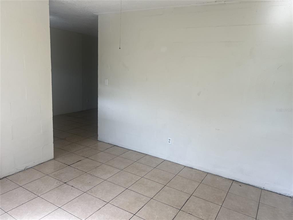 543 Division Street, Unit 3 Daytona Beach, FL 32114 - Photo 3 of 11 a view of an empty room