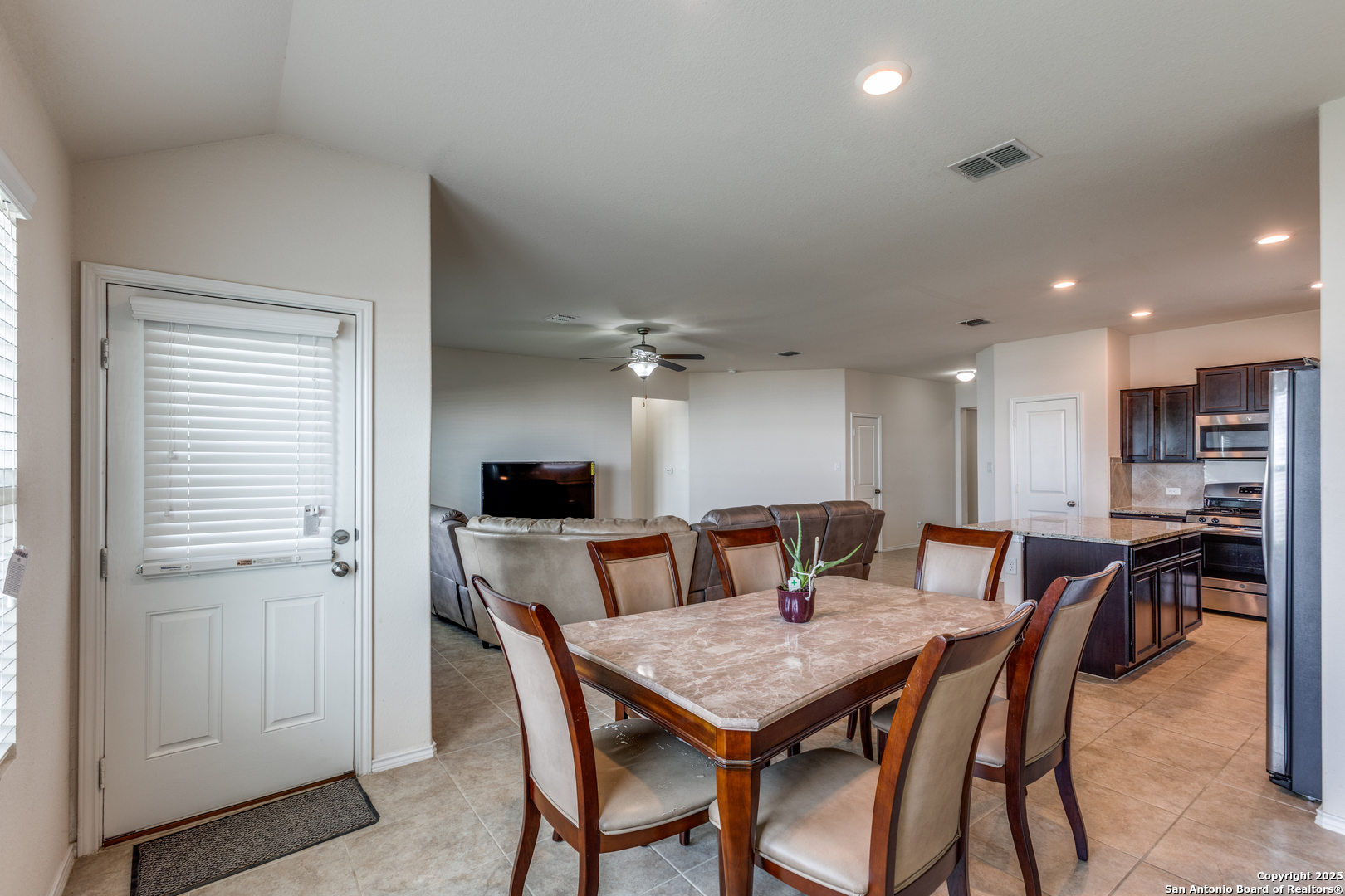 445 Red Morganite Trail Buda, TX 78610 - Photo 11 of 25 a view of a dining room with furniture