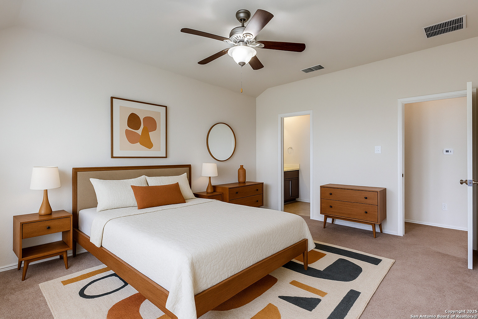 445 Red Morganite Trail Buda, TX 78610 - Photo 12 of 25 a bedroom with a bed and dresser