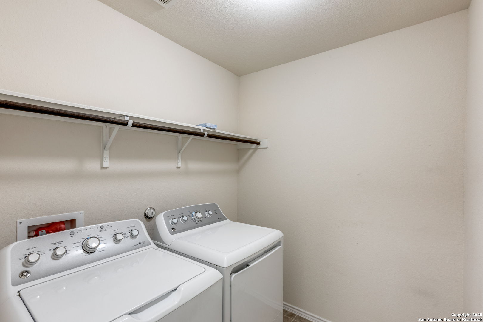 445 Red Morganite Trail Buda, TX 78610 - Photo 21 of 25 a utility room with dryer and washer