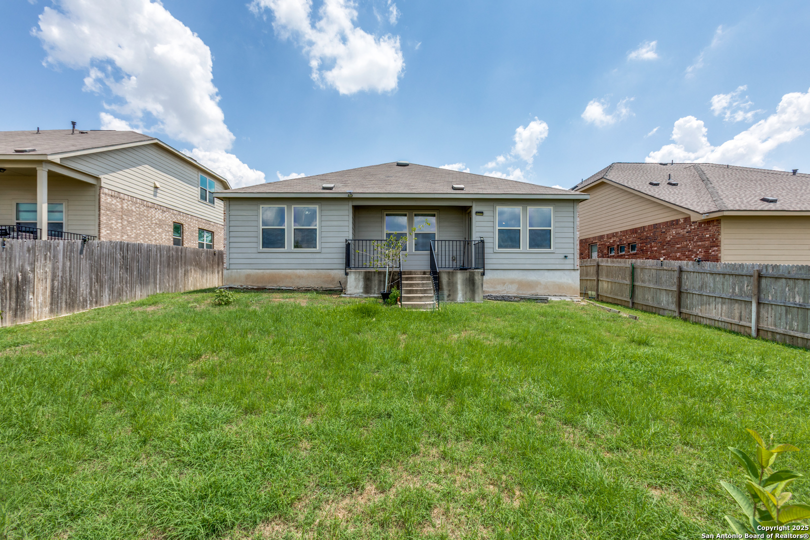 445 Red Morganite Trail Buda, TX 78610 - Photo 22 of 25 a view of a house with a yard and sitting area