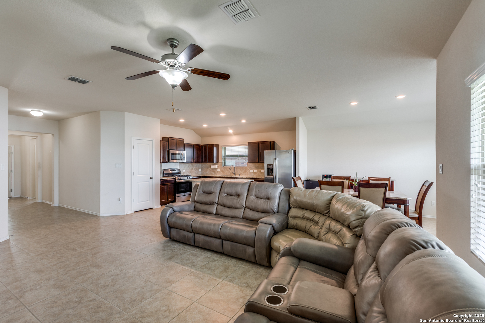 445 Red Morganite Trail Buda, TX 78610 - Photo 7 of 25 a living room with furniture and a ceiling fan