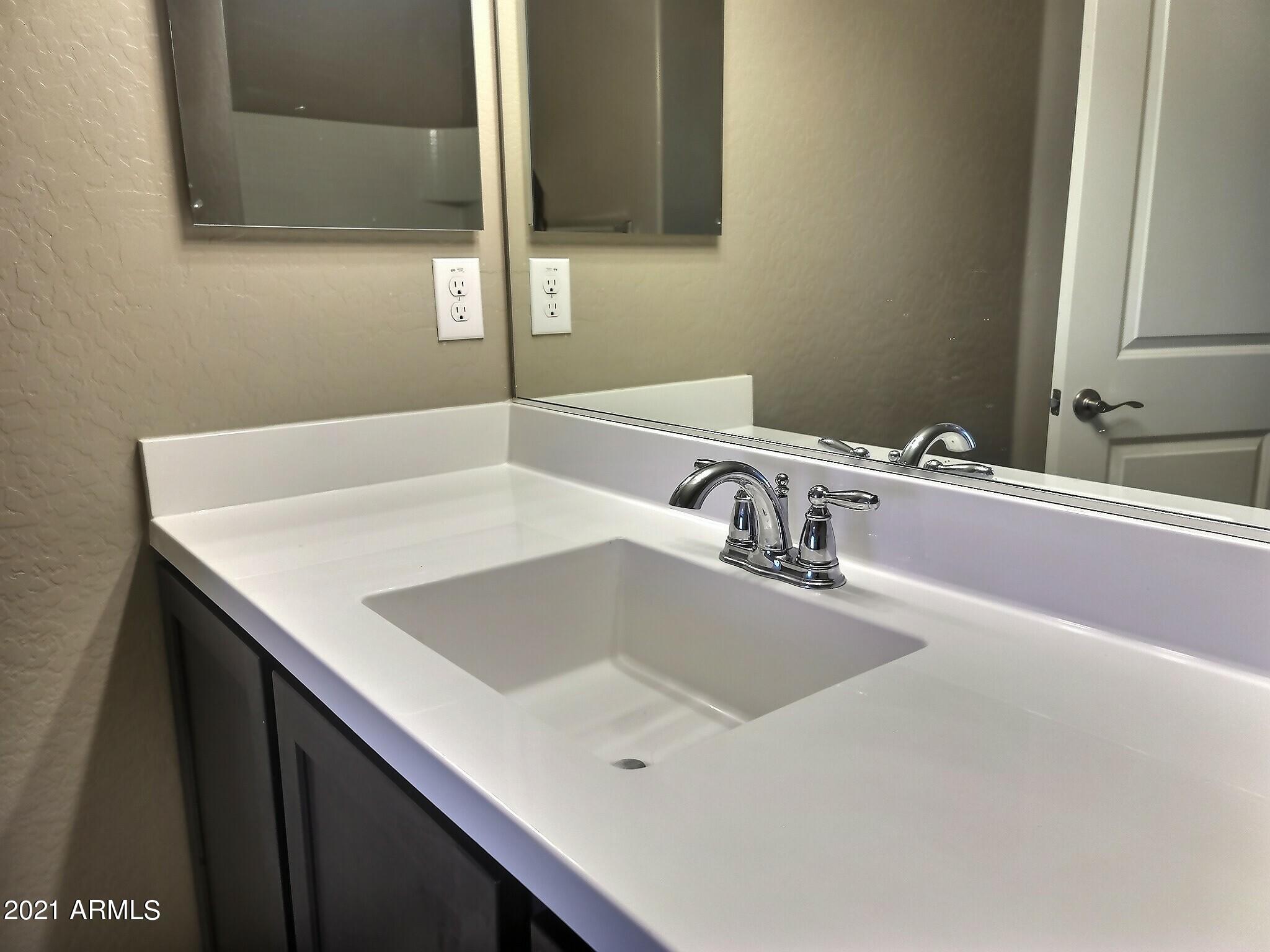 240 West Juniper Avenue, Unit 1111 Gilbert, AZ 85233 - Photo 12 of 22 a bathroom with a sink and a bathtub