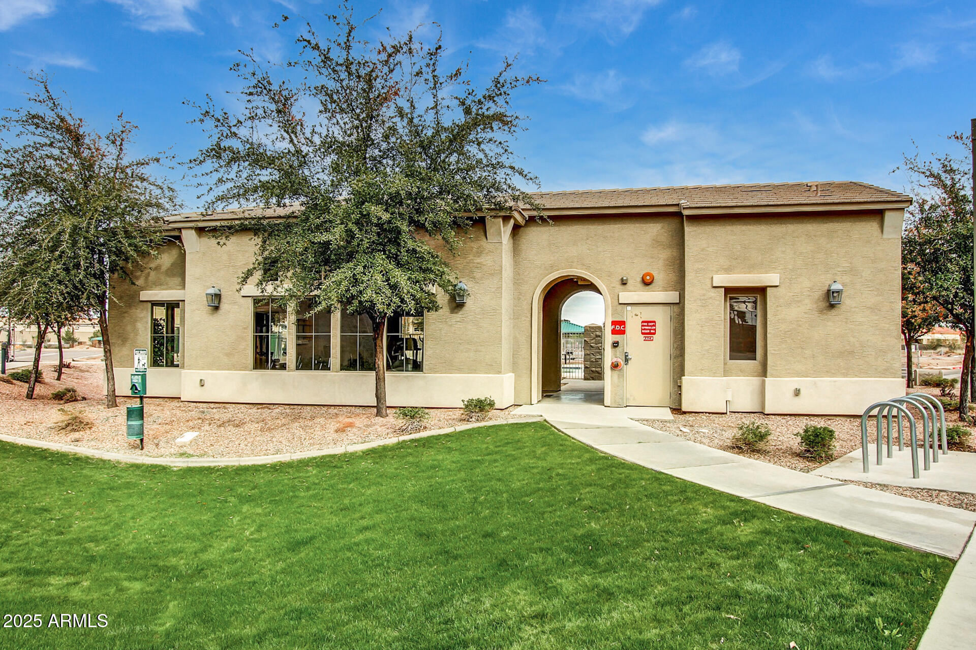 240 West Juniper Avenue, Unit 1111 Gilbert, AZ 85233 - Photo 16 of 22 a view of a house with a swimming pool