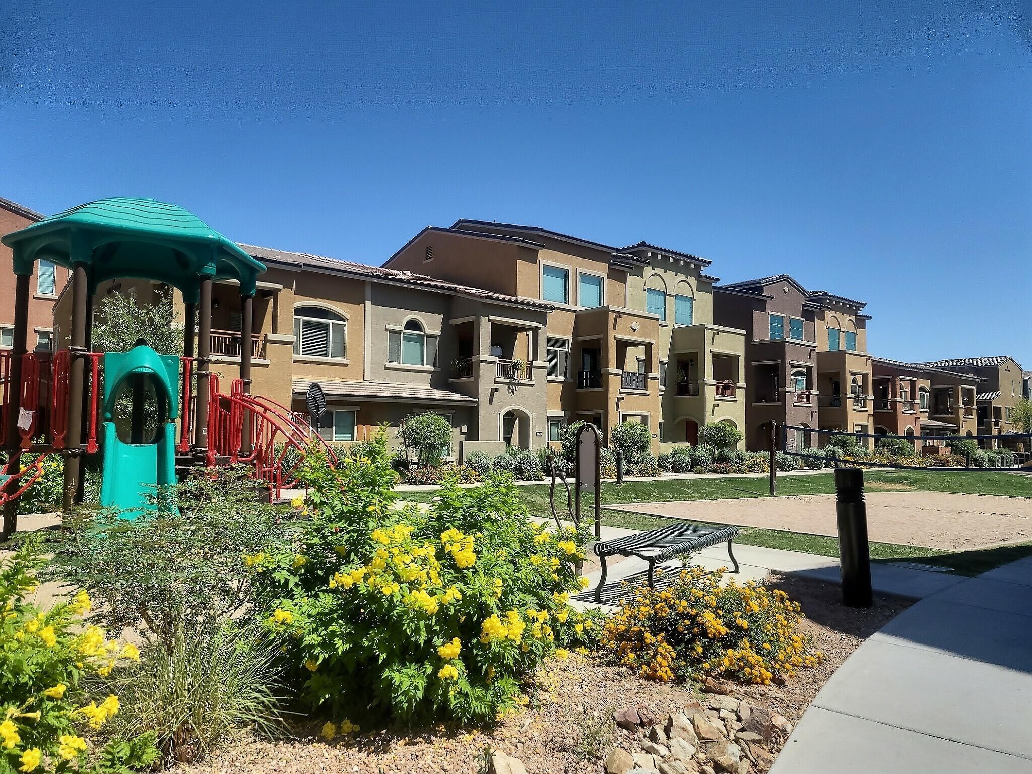 240 West Juniper Avenue, Unit 1111 Gilbert, AZ 85233 - Photo 18 of 22 a front view of a house with a yard