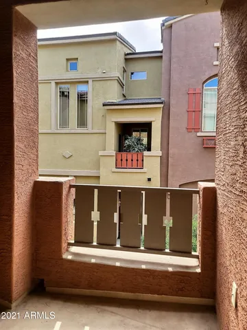 a black car parked in front of a building
