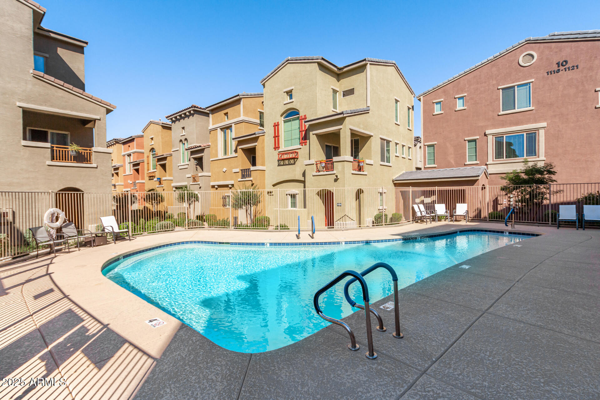 240 West Juniper Avenue, Unit 1111 Gilbert, AZ 85233 - Photo 22 of 22 a swimming pool with outdoor seating