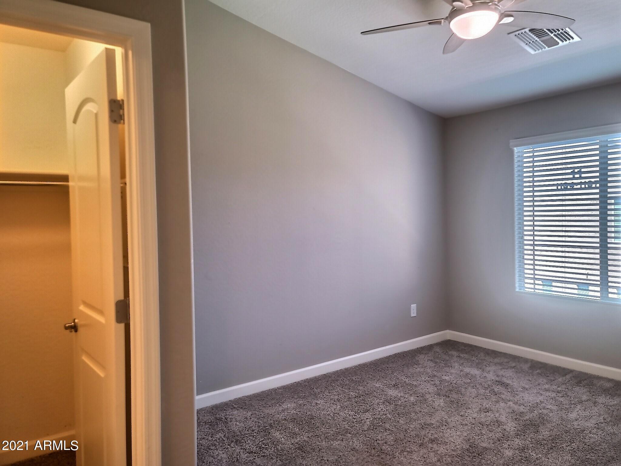 240 West Juniper Avenue, Unit 1111 Gilbert, AZ 85233 - Photo 10 of 22 a view of an empty room with a window