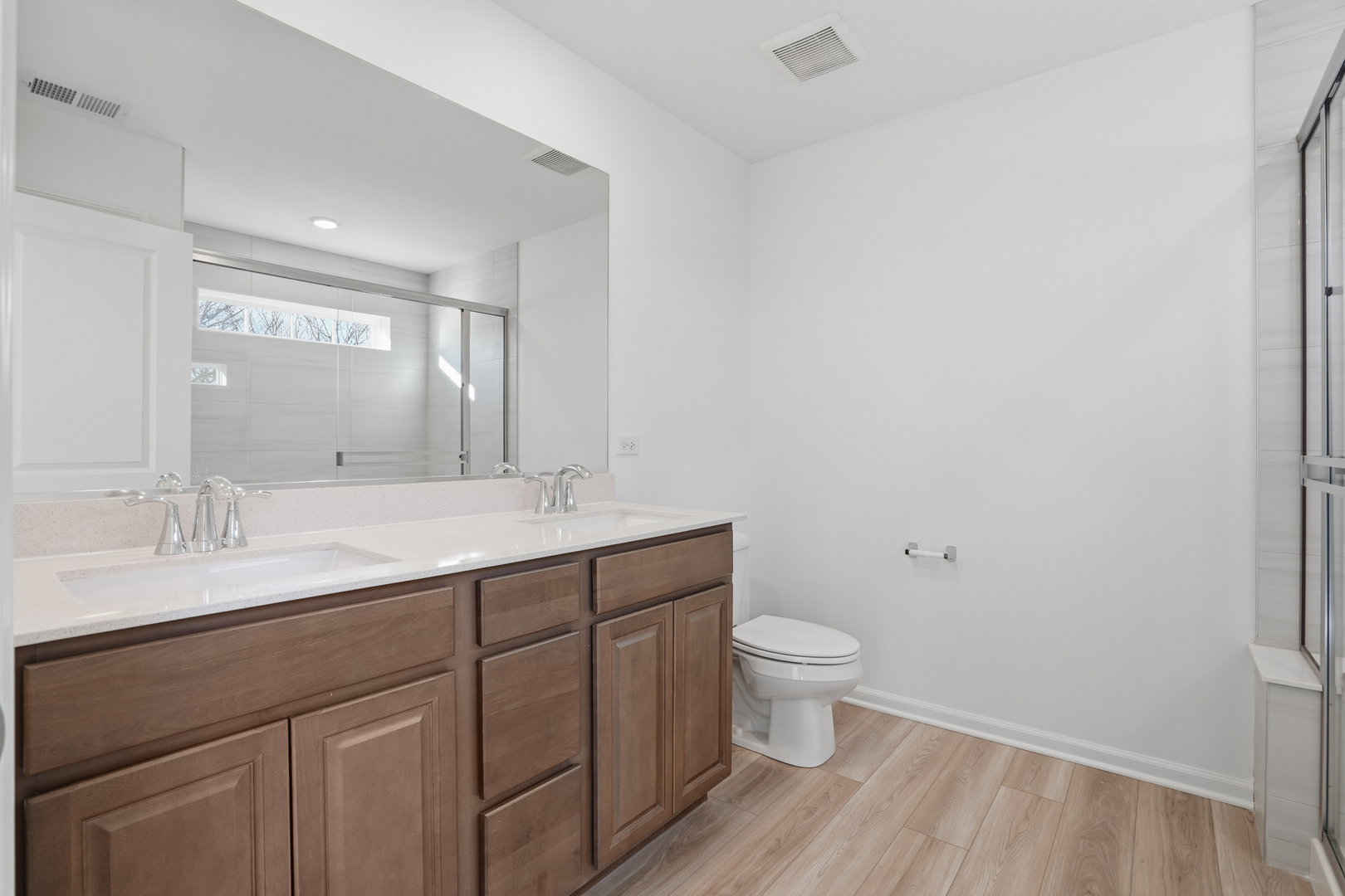 269 Red Oak Circle Volo, IL 60020 - Photo 11 of 17 a bathroom with a granite countertop sink a toilet and a mirror
