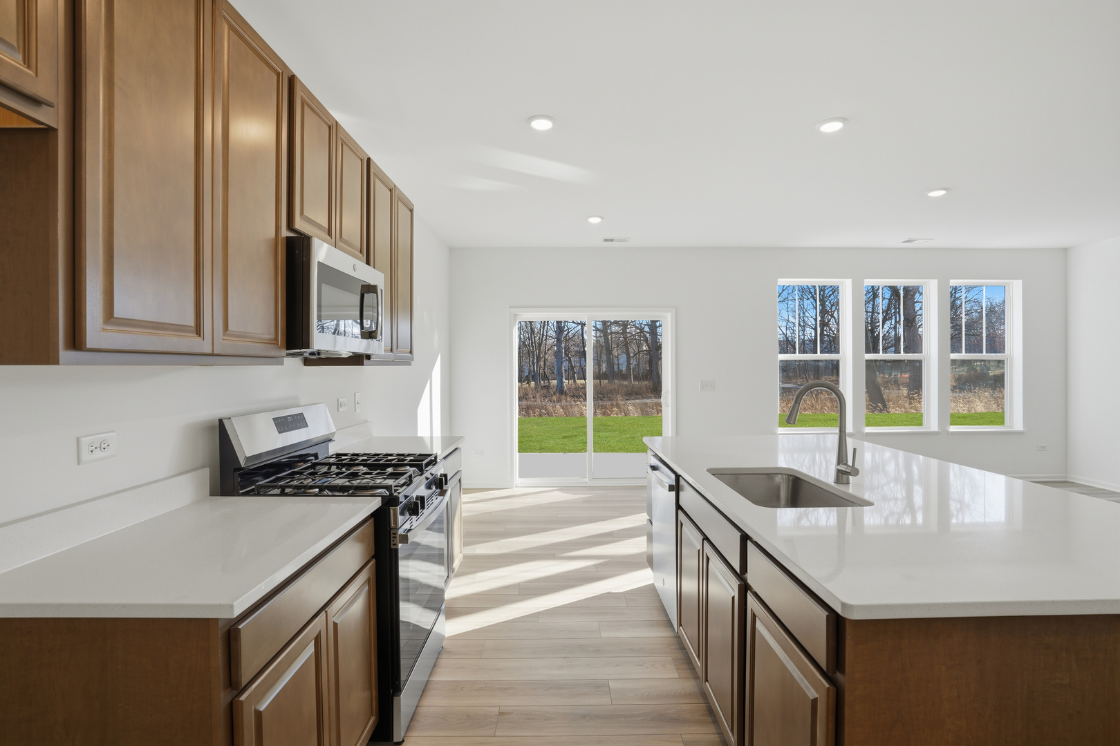 269 Red Oak Circle Volo, IL 60020 - Photo 4 of 17 a kitchen with stainless steel appliances granite countertop a sink and a stove