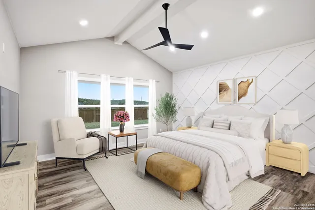 a bedroom with a bed large window and couch