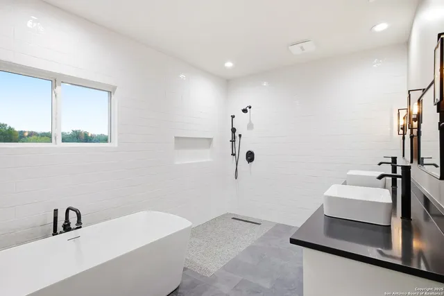 a bathroom with a double vanity sink