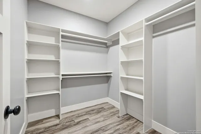 a view of an empty walk in closet