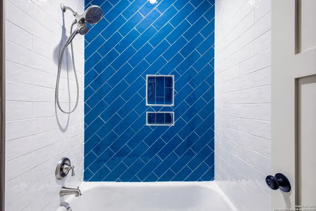 a bathroom with a sink and a shower