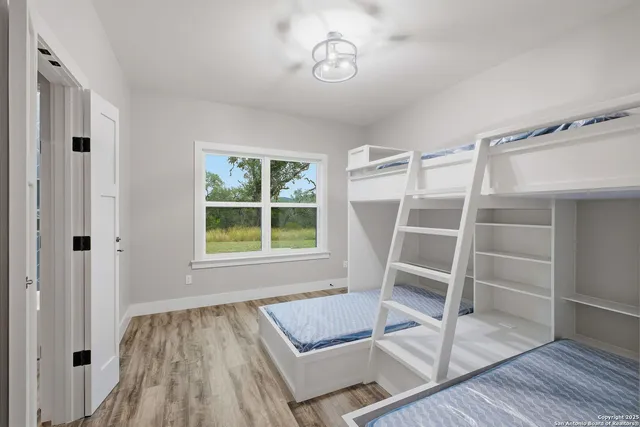 a view of wooden floor and windows in a room