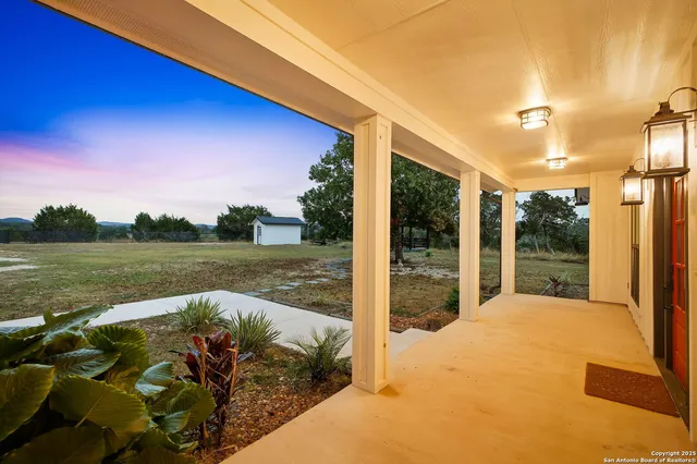 a swimming pool with trees in the background