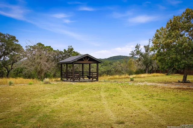a view of a balcony with wooden floor