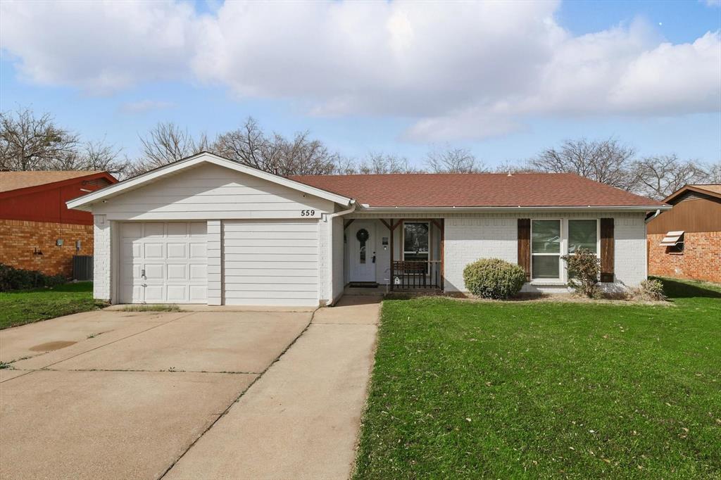559 Chambers Creek Drive Everman, TX 76140 - Photo 1 of 1 front view of a house with a yard