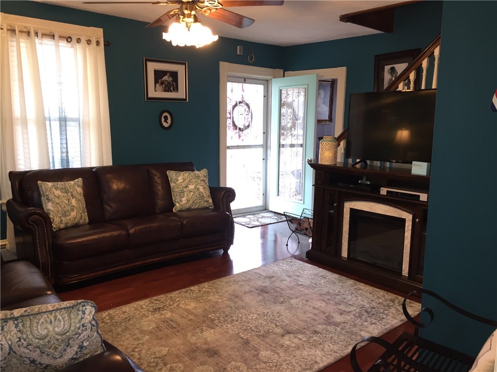 536 Child Street Warren, RI 02885 - Photo 3 of 33 WARM AND INVITING FAMILY ROOM WITH WET BAR, ACCESS TO WRAP AROUND PORCH AND OPEN KITCHEN DINING AREA.