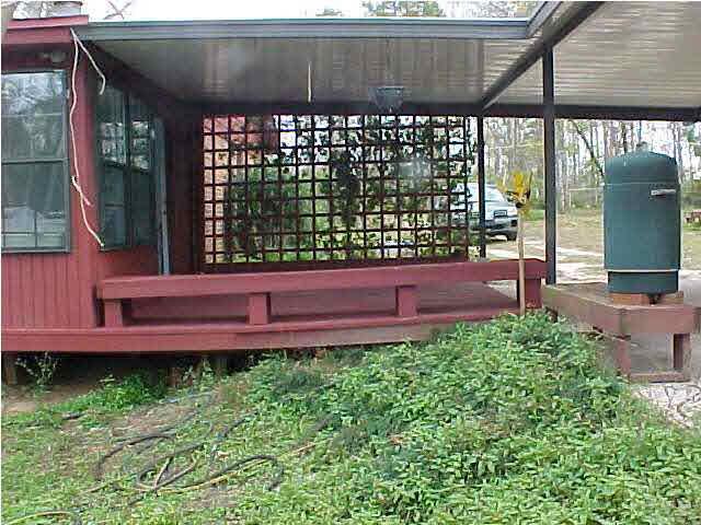 1399 Wishbone Road Cantonment, FL 32533 - Photo 6 of 18 BACK VIEW OF THE DECK/CARPORT