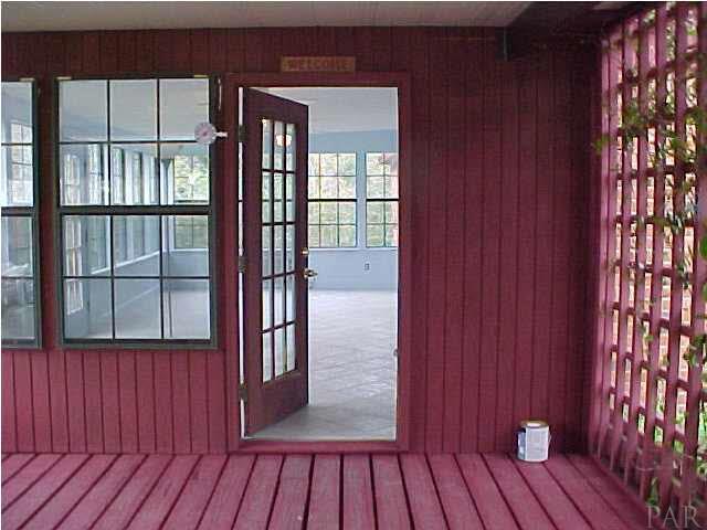 1399 Wishbone Road Cantonment, FL 32533 - Photo 7 of 18 WALK ACROSS THE RAISED DECK, TO THE FLORIDA ROOM AND SAY "HI HONEY, I'M HOME"