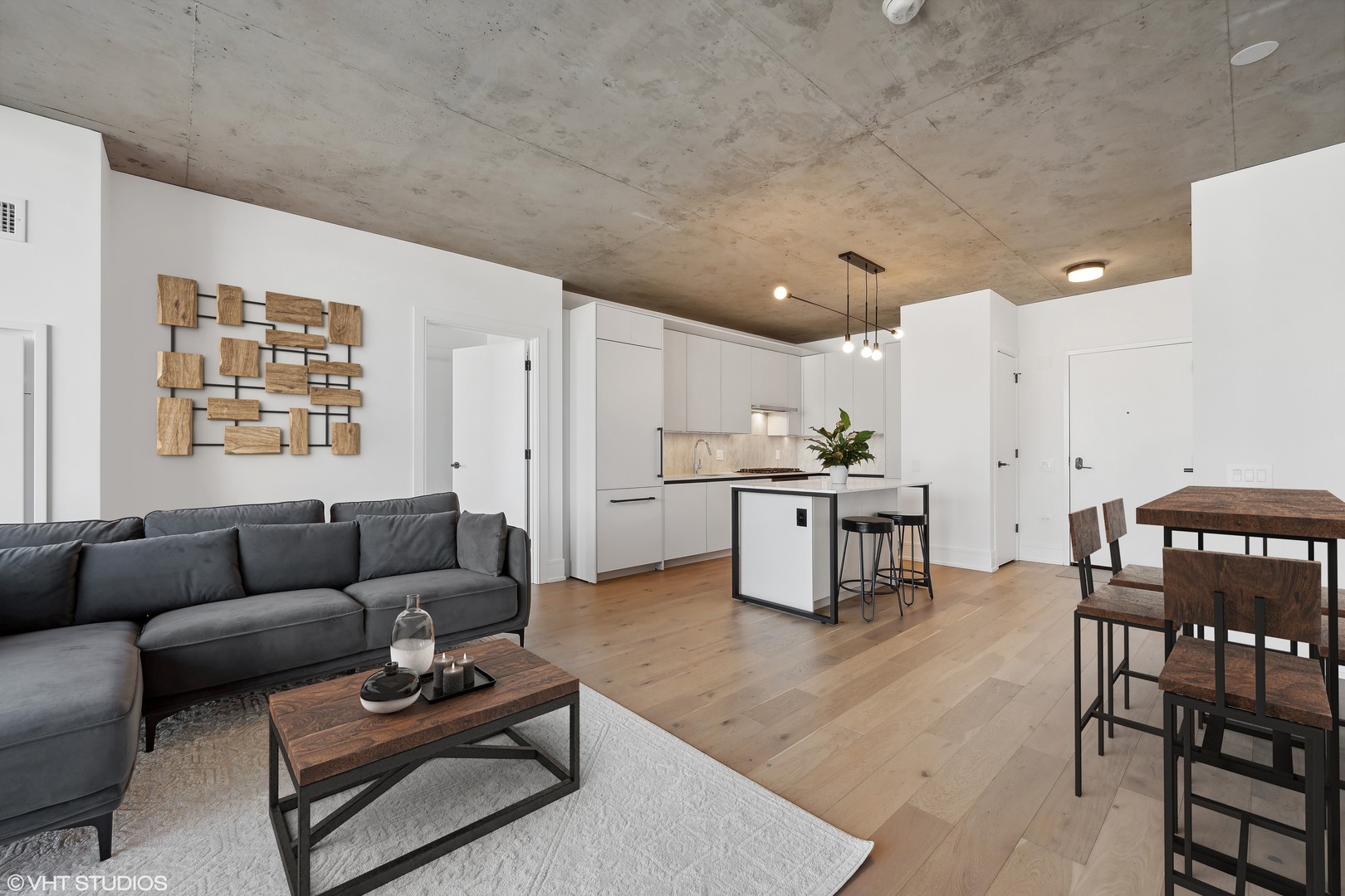 234 West Polk Street, Unit 2610 Chicago, IL 60607 - Photo 14 of 43 a living room with furniture and kitchen view