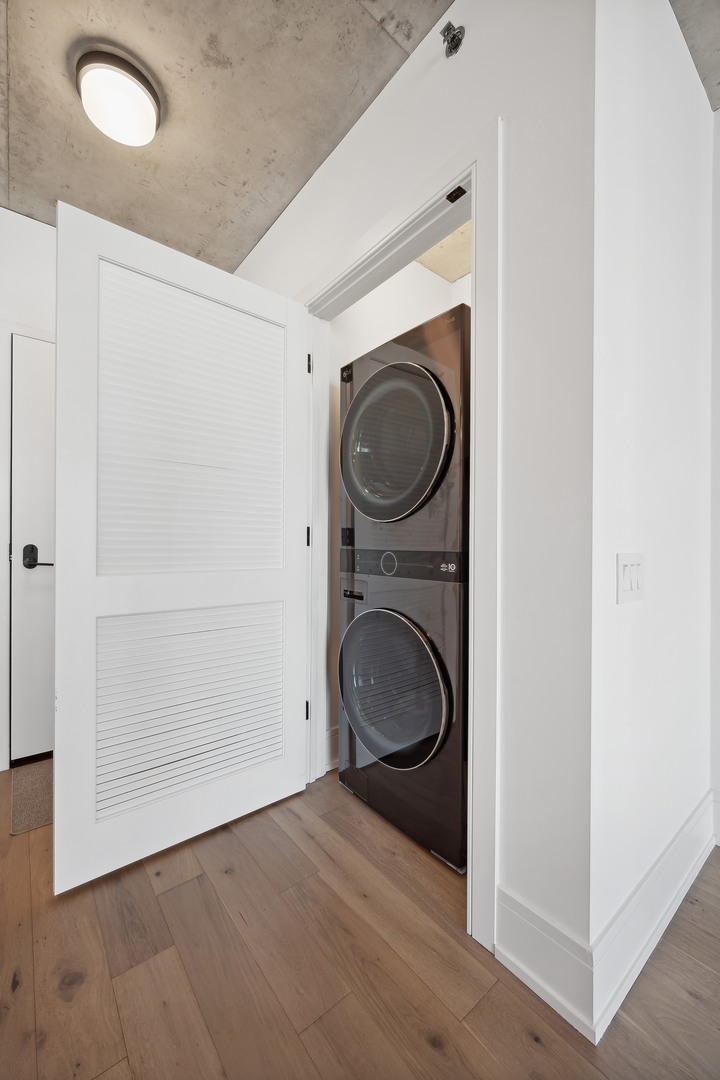 234 West Polk Street, Unit 2610 Chicago, IL 60607 - Photo 19 of 43 a view of a storage & utility room with washer and dryer