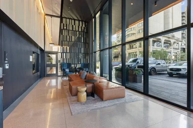 a view of a patio with a table and chairs under an umbrella