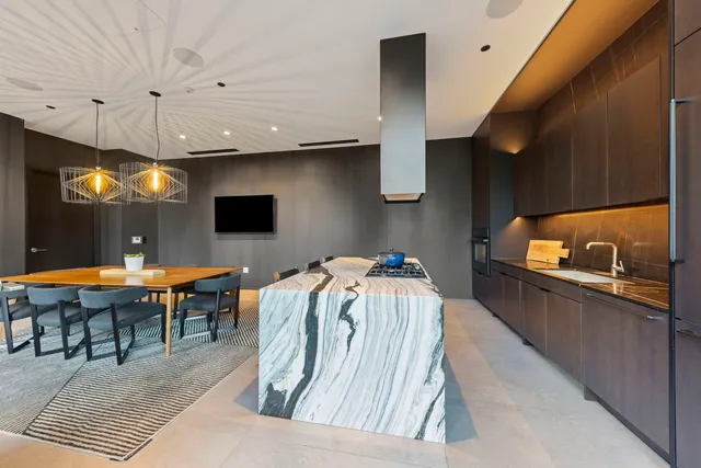 a room with furniture pool table and flat screen tv