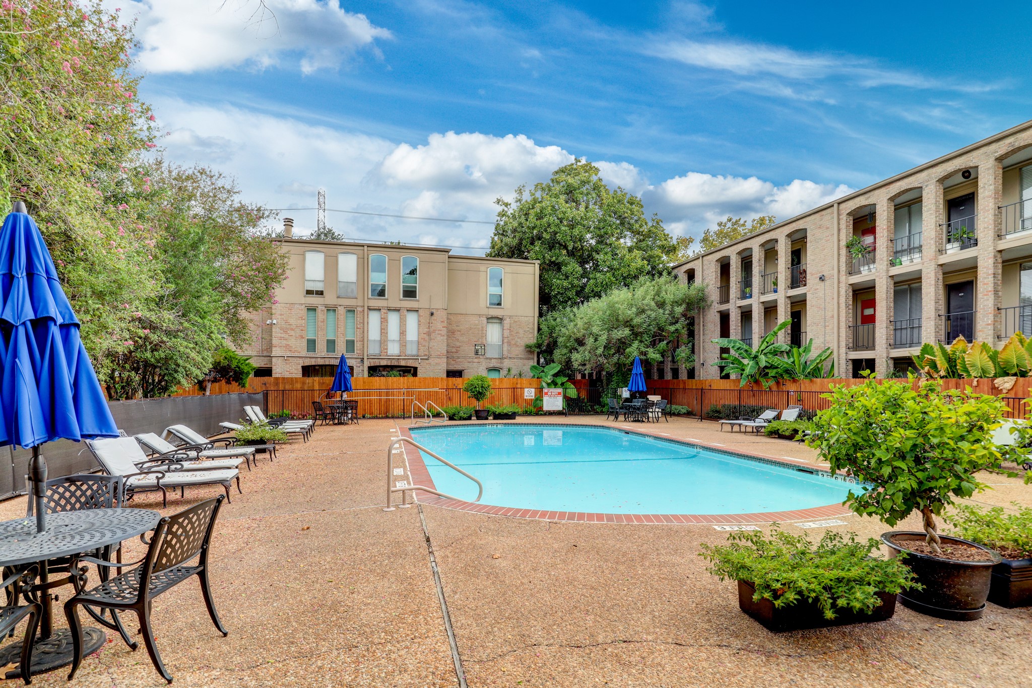4641 Wild Indigo Street, Unit 439 Houston, TX 77027 - Photo 10 of 10 a view of swimming pool with outdoor seating and plants