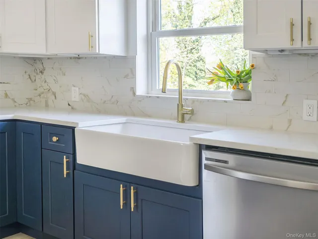 a kitchen with a sink and a window