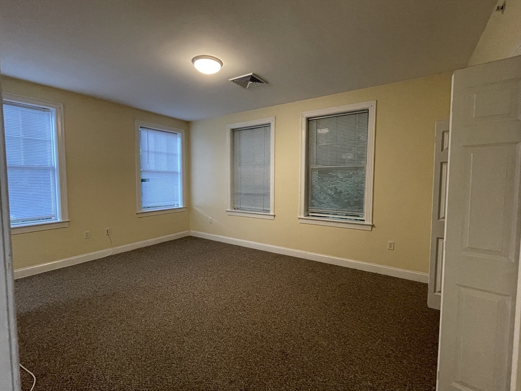 81-87 Fairmount Avenue, Unit 8 Boston, MA 02136 - Photo 6 of 12 a view of an empty room with a window