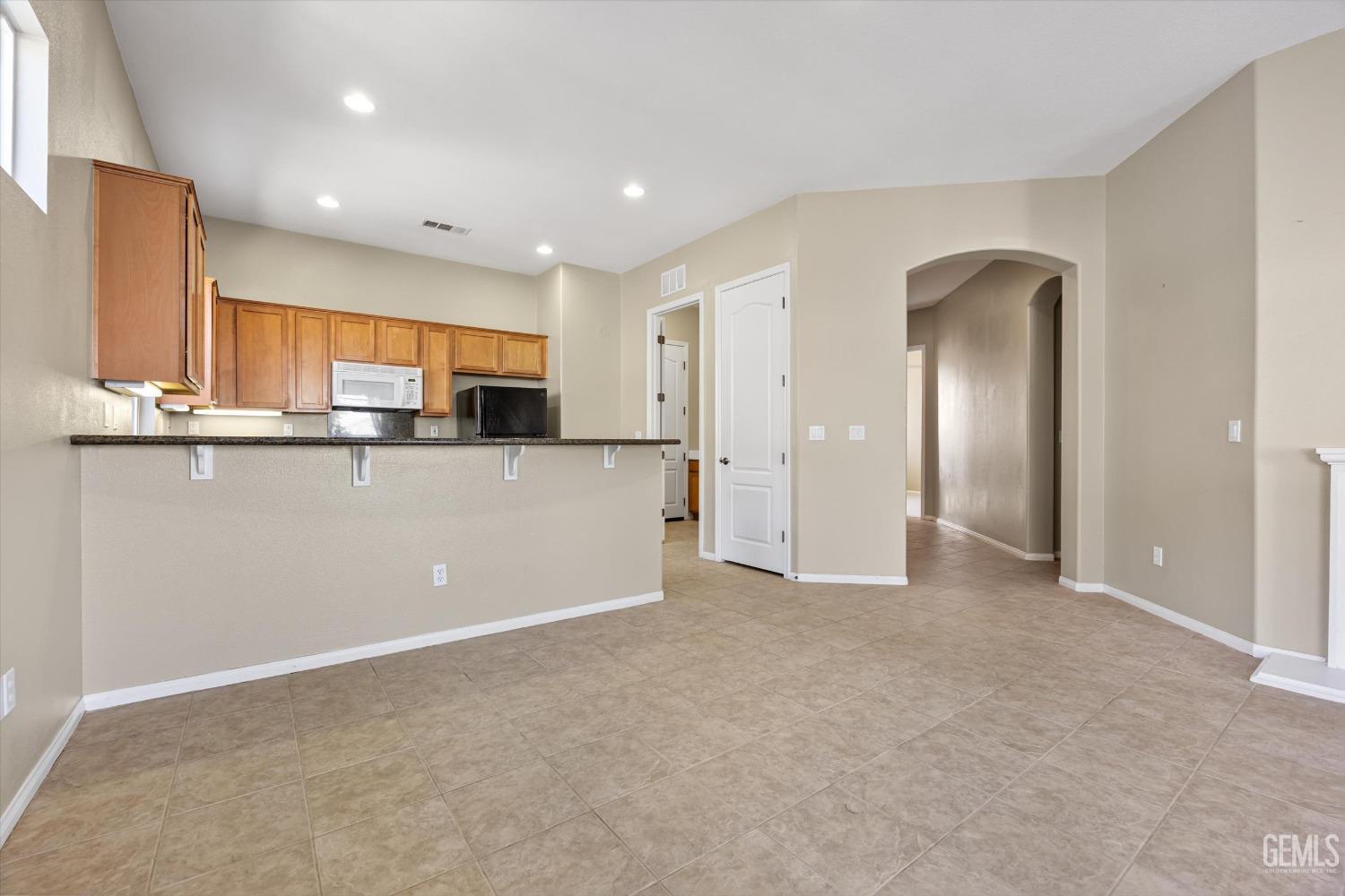 Undisclosed Address Bakersfield, CA 93306 - Photo 13 of 35 a view of a kitchen with a sink and cabinets