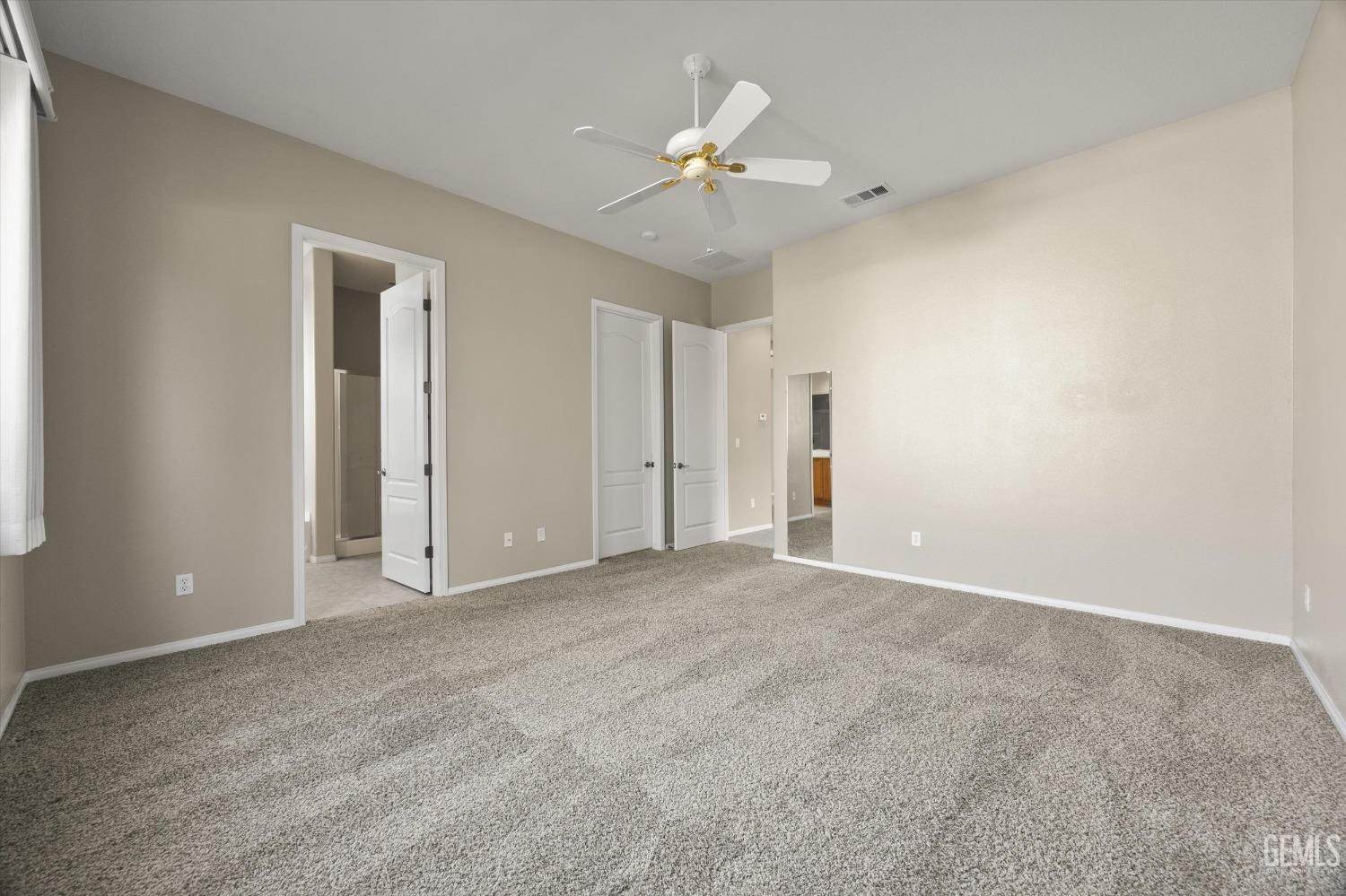 Undisclosed Address Bakersfield, CA 93306 - Photo 19 of 35 a view of an empty room with a ceiling fan