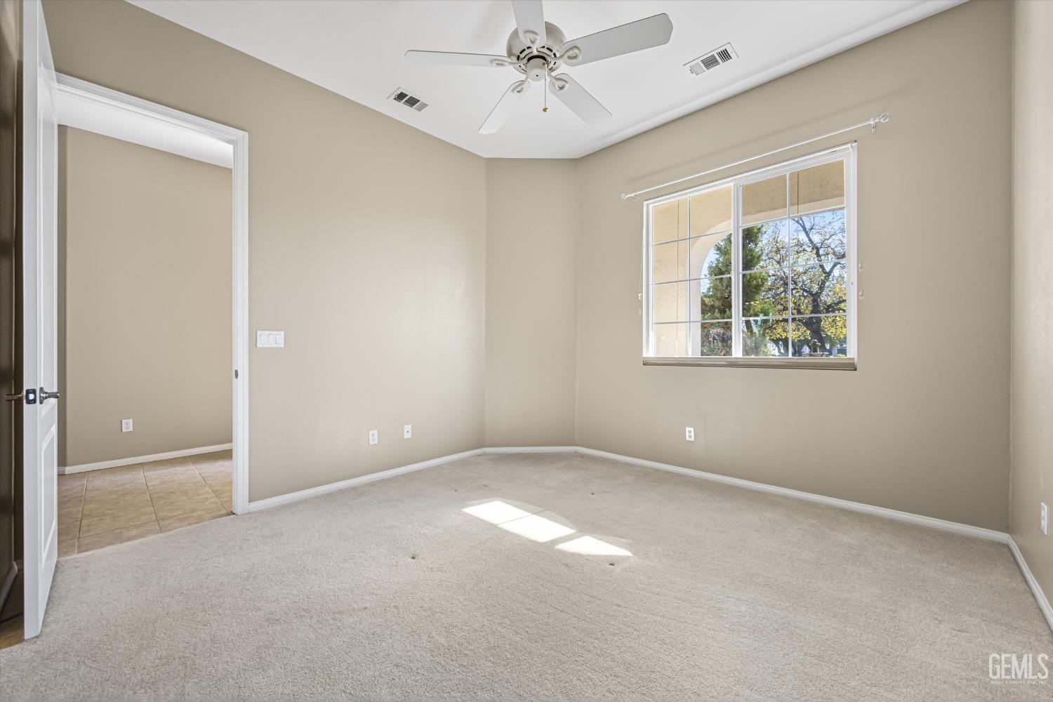 Undisclosed Address Bakersfield, CA 93306 - Photo 23 of 35 a view of an empty room with a window