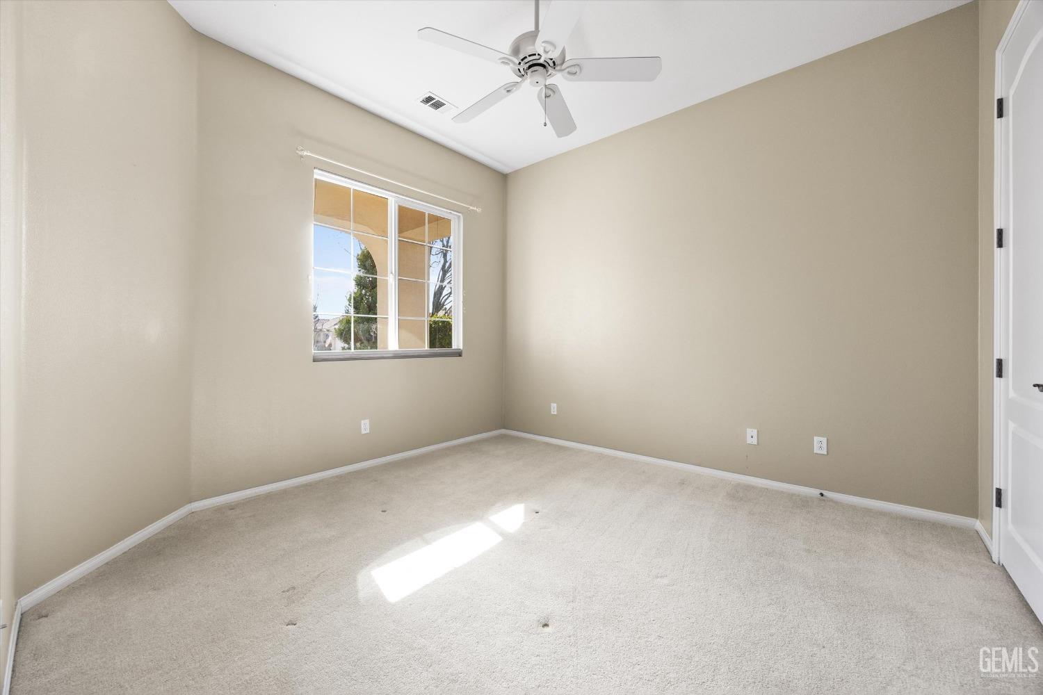 Undisclosed Address Bakersfield, CA 93306 - Photo 26 of 35 an empty room with windows and fan